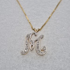 14kt Gold Lady's Initial "M" Diamond Pendant on a 16" Box Chain