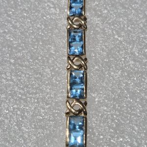 14Kt Gold Lady's Square Blue Topaz Tennis Bracelet w/28 each 4mm Gemstones