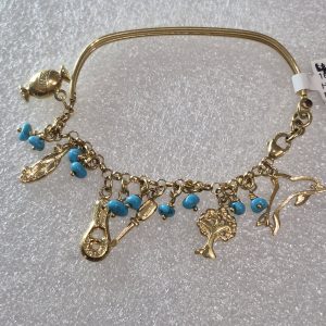 18kt Hand Fashioned Turquoise and Charm Bracelet from Egypt.